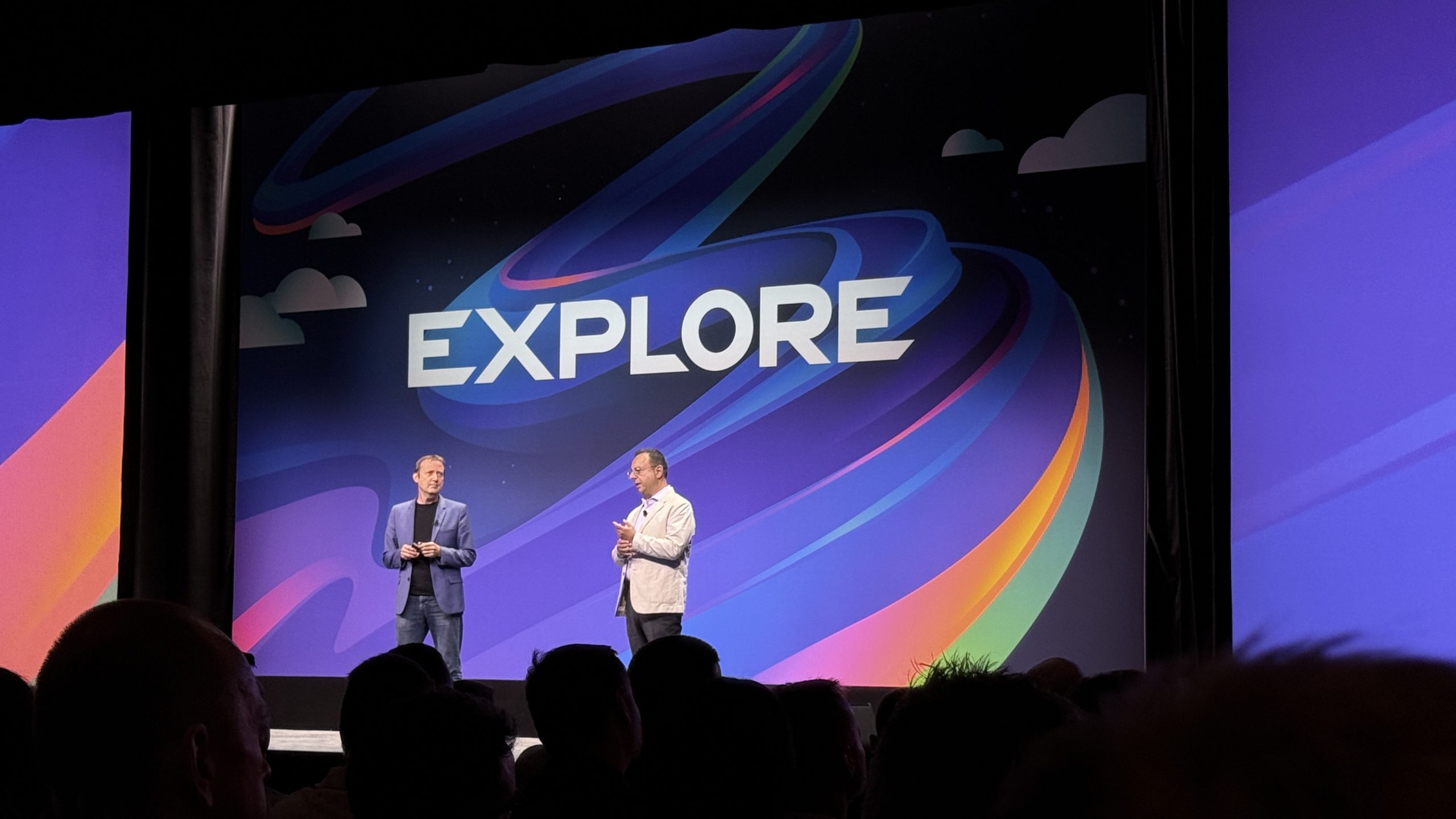Two speakers on the main stage under the VMware Explore logo